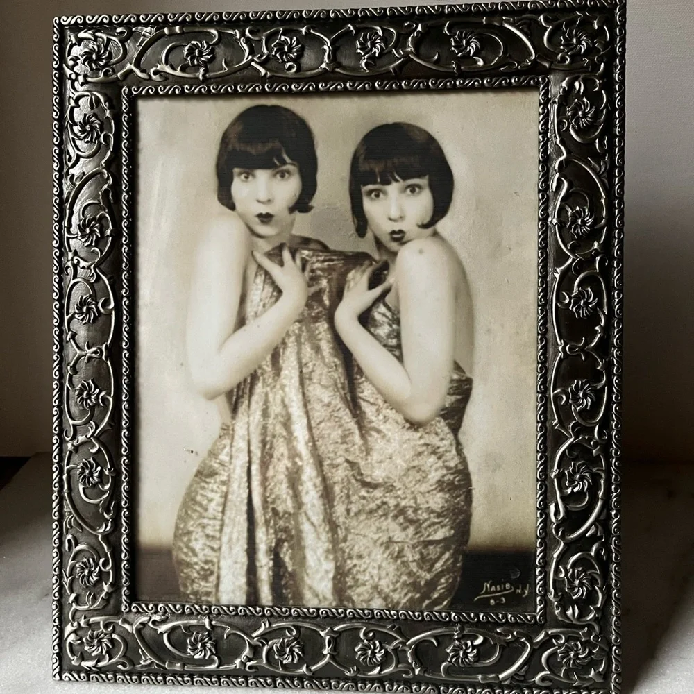 Large ornate silver Frame for photo 8”x10” free standing..